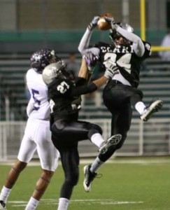Jacob Garcia, Joe Vasquez #27 Garcia and #24 Vasquez defend and intercept Warren